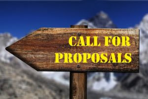 The picture shows a sign with the text "call for proposals"